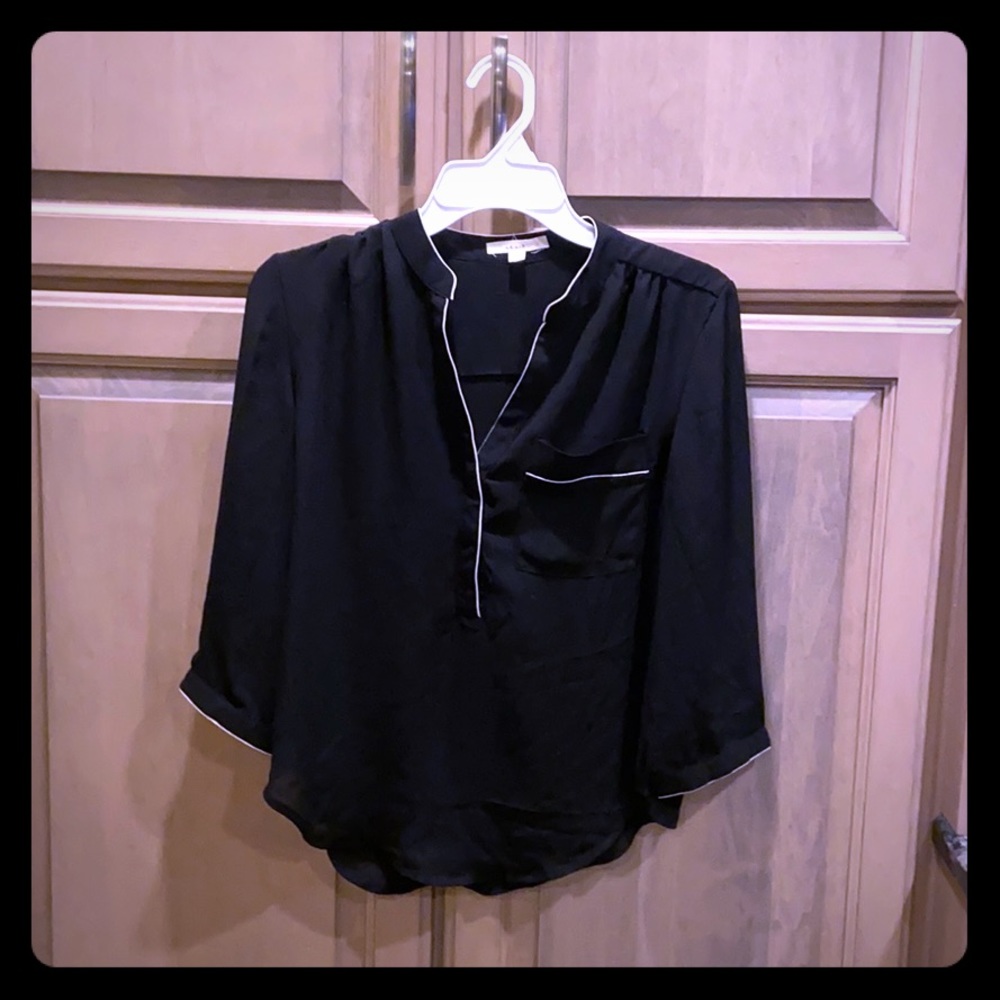Mid length black top with white detail